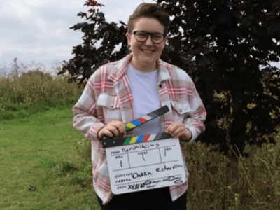 Person holding clapperboard